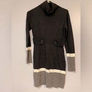 Black cowl neck sweater dress with long sleeves and gray and white accent strips